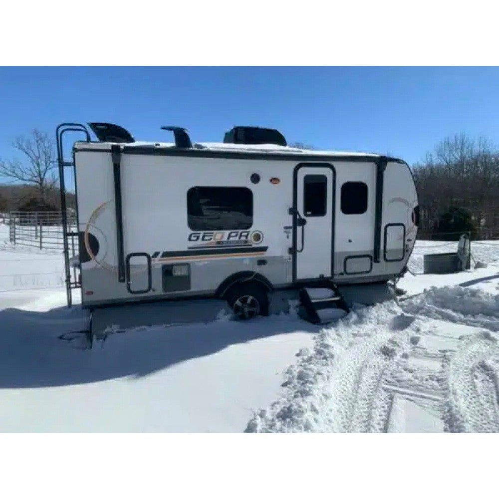 camper skirting kit image showing the airskirts tiny rv skirt inflated tubing placed under rv in the snow side view