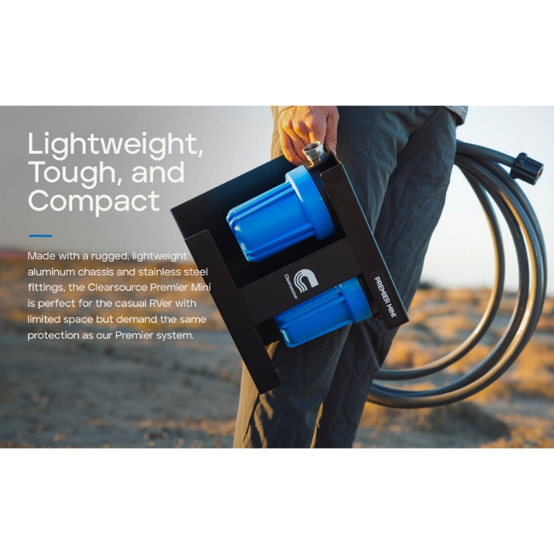 Clearsource Premier Mini water filter lifestyle photo showing a person holding the water filter system outside in the sunset lightweight tough and compact