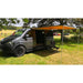f35 pro 250 image that shows the RV awning fully extended on a dark gray van corner view