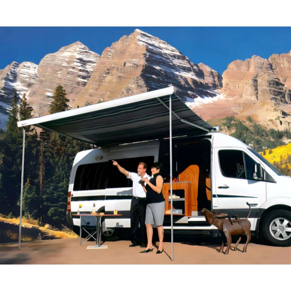F80 Fiamma Awning lifestyle image showing two people standing under their RV awning in the mountains