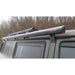 fiamma f35 pro black image that shows a closeup of the black awning fully retracted on the side of a van