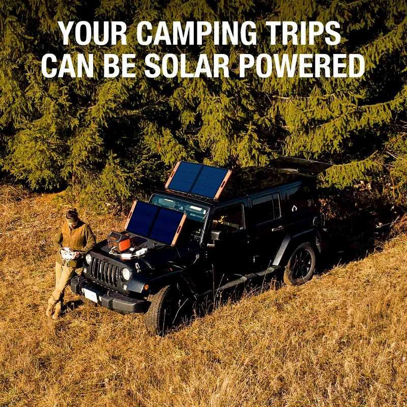 jackery 1000 watt solar generator lifestyle image showing a person leaning on front of jeep with solar panels sitting on top of vehicle