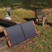 jackery 500 sale lifestyle photo showing the power station hooked up to the optional solar panel. 