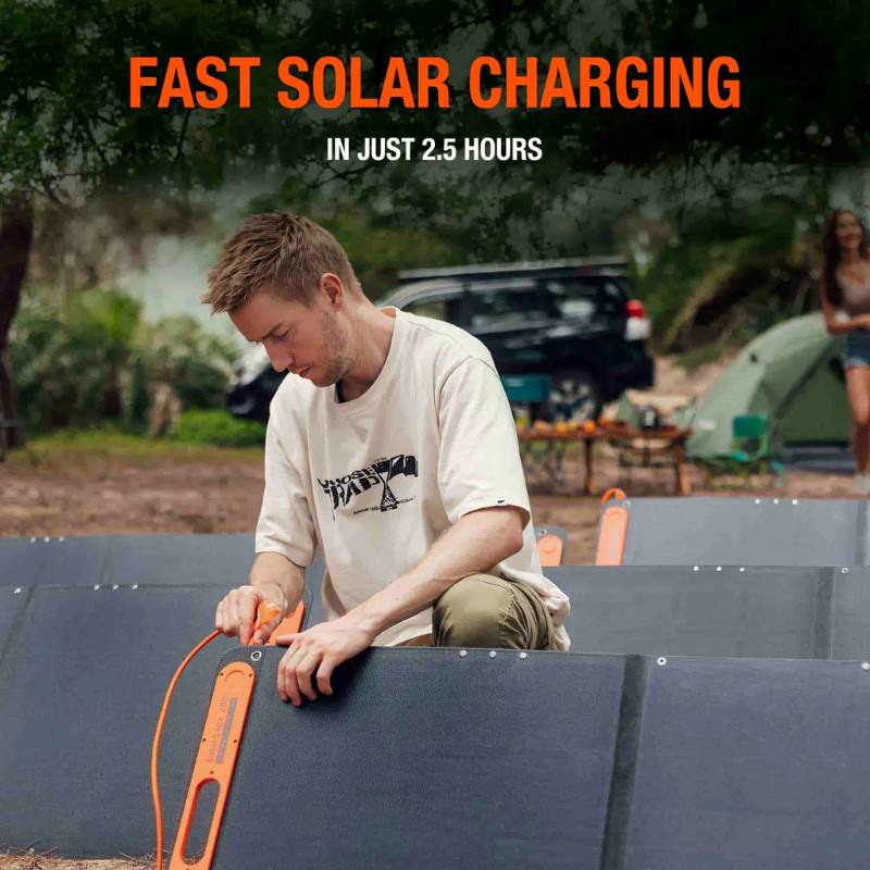 jackery solar generator 2000 image showing a person outside plugging in the solar panels