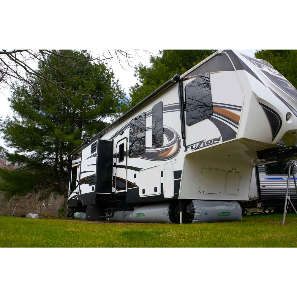 rv airskirts image showing a fuzion trailer on the grass with all of inflatable tubes placed underneath corner view