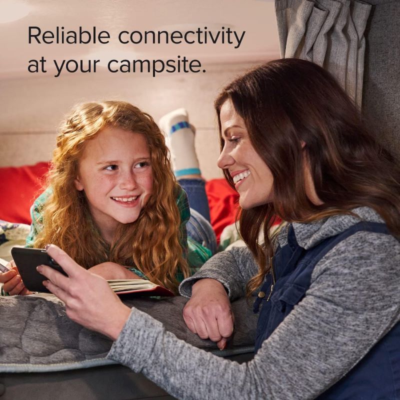 weBoost Destination RV Lifestyle Photo showing a mother and daughter looking at a cell phone in an RV